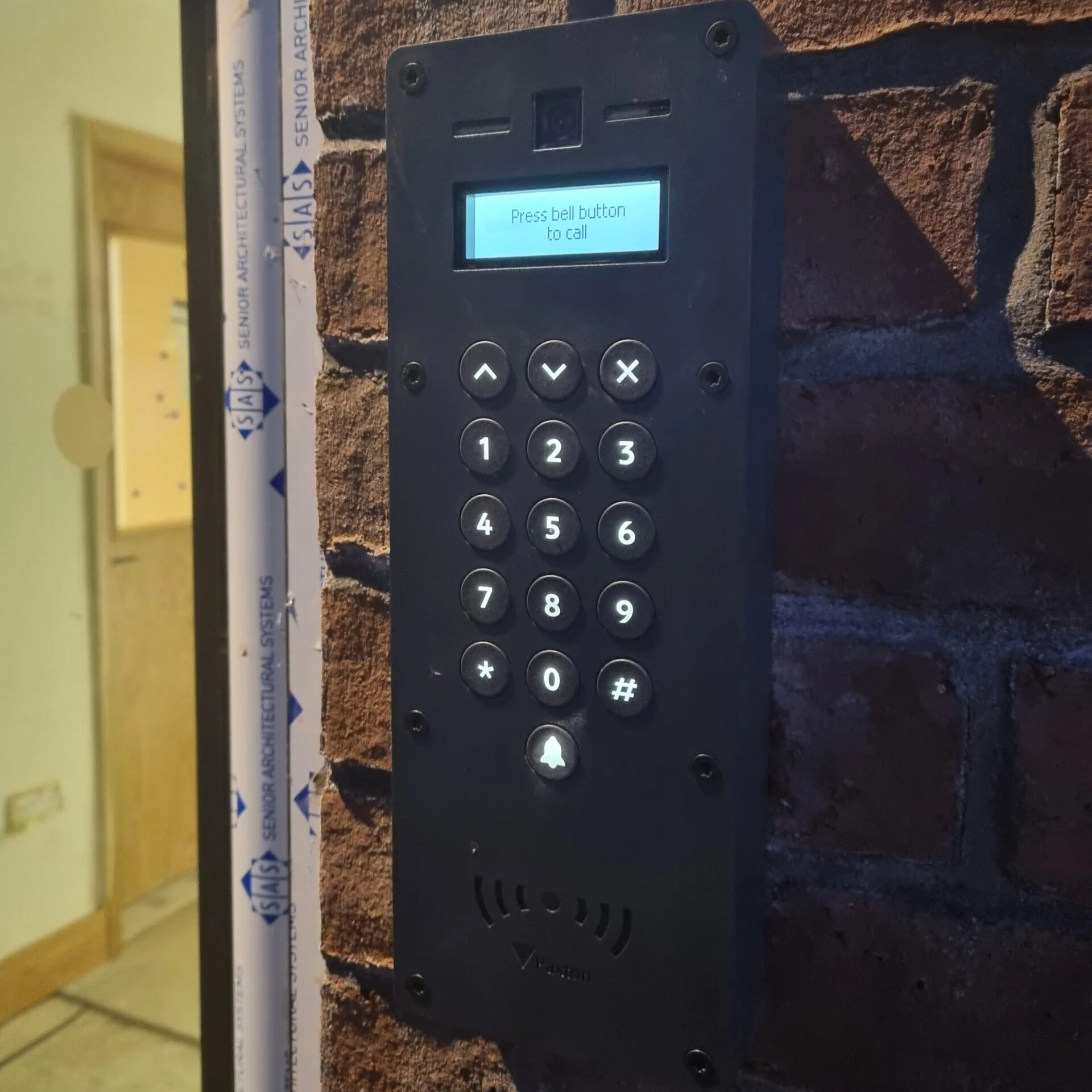 Paxton access control intercom unit mounted on an external wall.